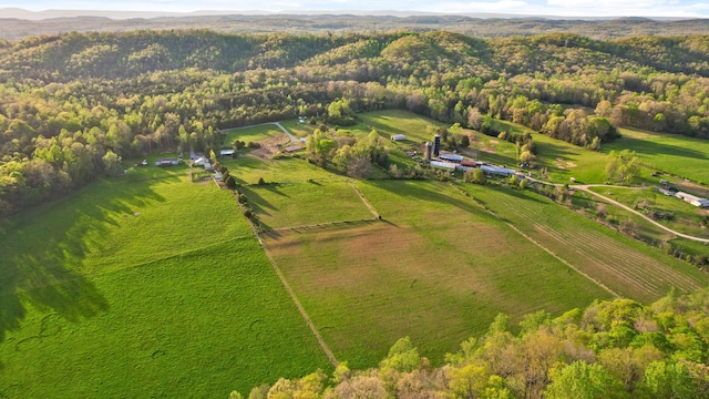 drone / aerial view with a forest view and a rural view