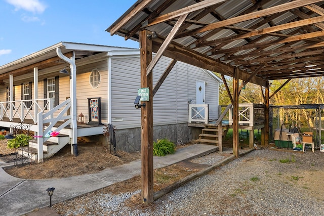 view of side of home with covered porch