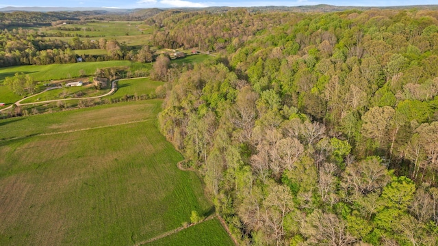 bird's eye view featuring a wooded view