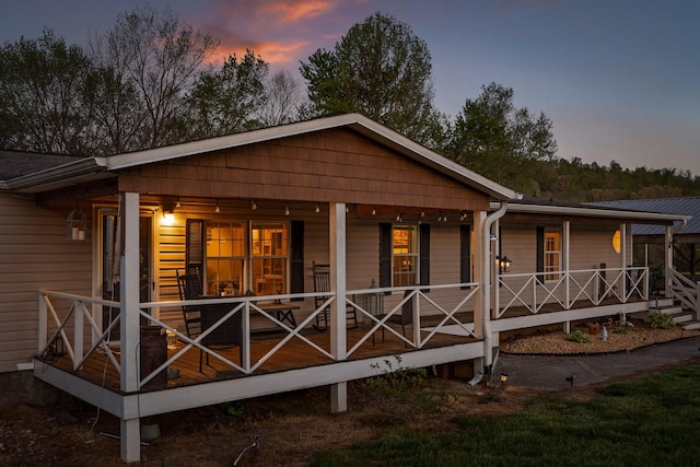 back of house with a porch