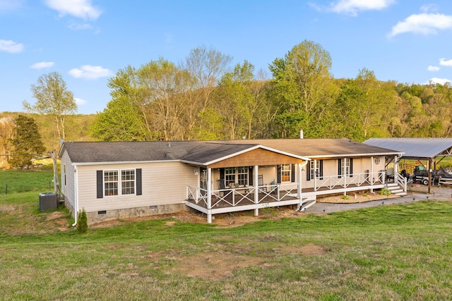 rear view of property featuring crawl space, cooling unit, a yard, covered porch, and a carport