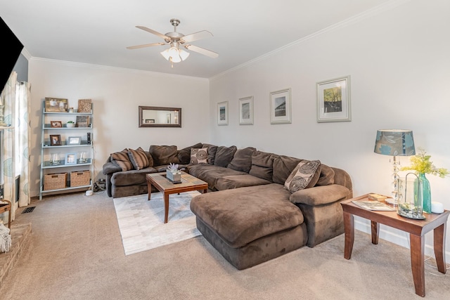 living room with crown molding, ceiling fan, and light carpet