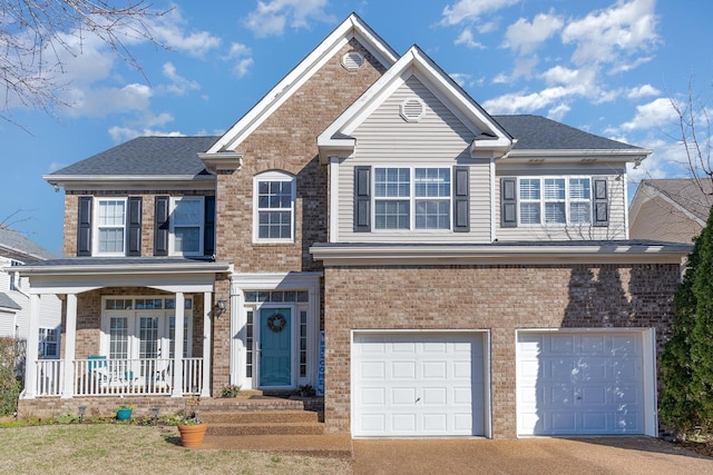 view of front of home featuring a garage, brick siding, driveway, and covered porch