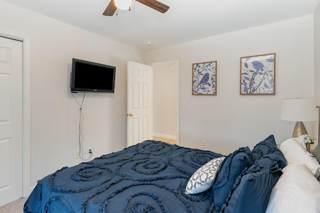 carpeted bedroom featuring ceiling fan