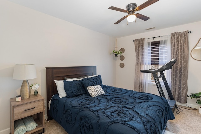 bedroom featuring carpet flooring, baseboards, a ceiling fan, and visible vents