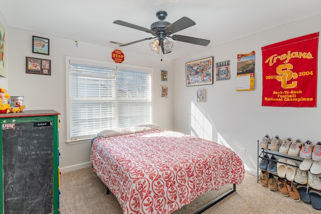 bedroom featuring carpet, visible vents, baseboards, and ceiling fan