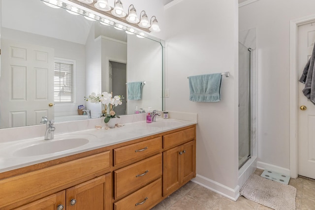full bathroom with a sink, tile patterned flooring, and a stall shower