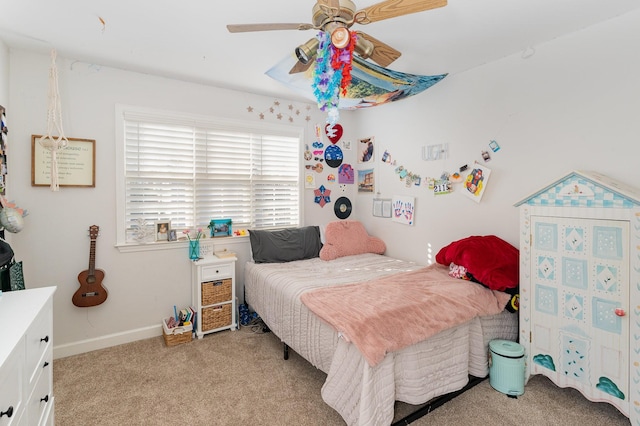 bedroom featuring baseboards, a ceiling fan, and light carpet