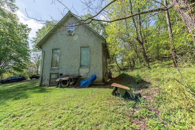 176 Water Ln NW, Charleston, TN 37310 - view of side of home featuring a lawn and stucco siding