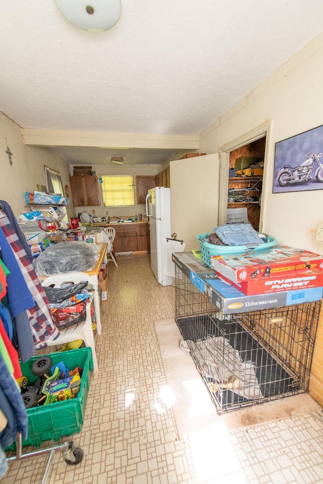 176 Water Ln NW, Charleston, TN 37310 - interior space featuring freestanding refrigerator and light floors