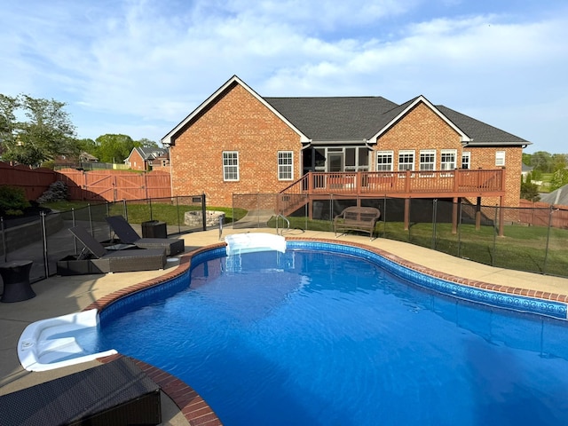 view of pool with a patio area, a fenced backyard, a fenced in pool, a wooden deck, and stairs