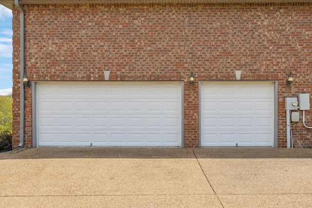 garage featuring driveway