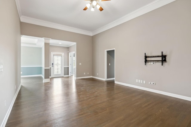 unfurnished room featuring baseboards, a ceiling fan, and crown molding