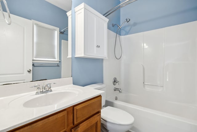 full bath featuring toilet, vanity, and bathing tub / shower combination