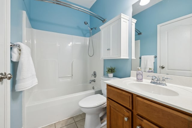 bathroom with vanity, toilet, tile patterned flooring, and bathing tub / shower combination