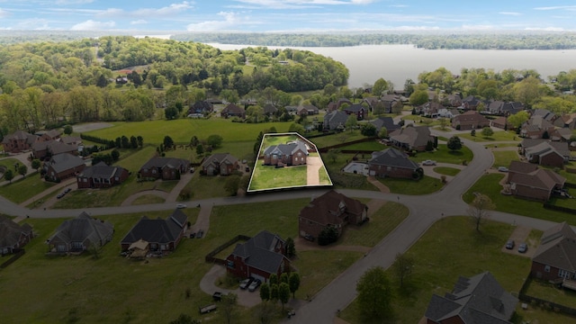 birds eye view of property with a water view and a residential view