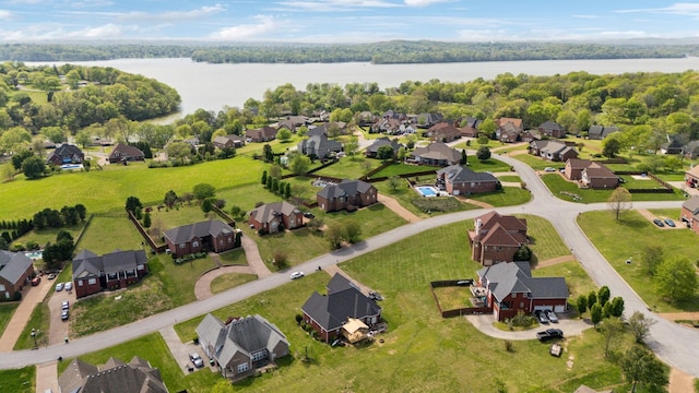 birds eye view of property with a water view and a residential view
