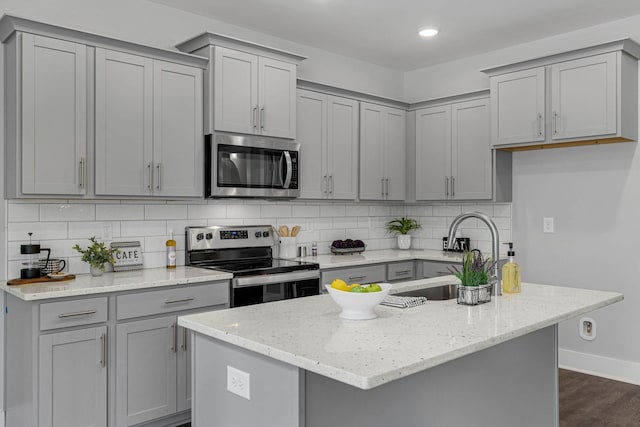 558 Twyla Dr, Lebanon, TN 37087 - kitchen with stainless steel appliances, gray cabinets, tasteful backsplash, and recessed lighting
