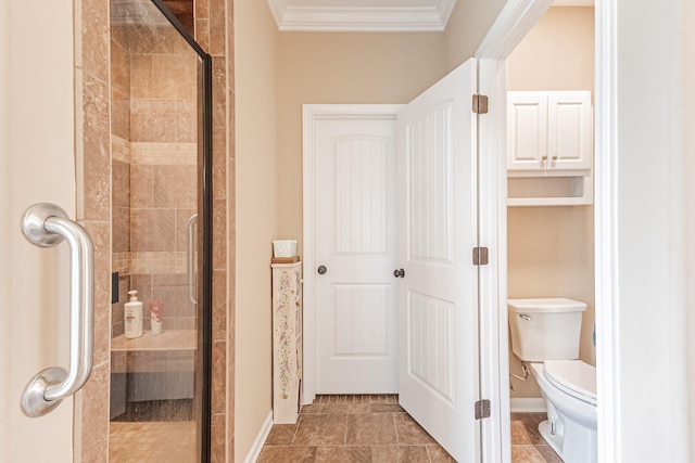 133 Kildeer Dr, Clarksville, TN 37040 - bathroom featuring toilet, a stall shower, baseboards, and ornamental molding
