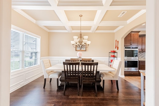 133 Kildeer Dr, Clarksville, TN 37040 - dining room featuring dark wood-style flooring, a chandelier, beam ceiling, coffered ceiling, and arched walkways