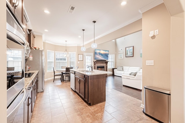133 Kildeer Dr, Clarksville, TN 37040 - kitchen with a sink, dark brown cabinets, ornamental molding, and stainless steel appliances