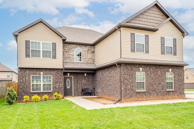 133 Kildeer Dr, Clarksville, TN 37040 - view of front of property with a front yard, brick siding, a patio area, and fence