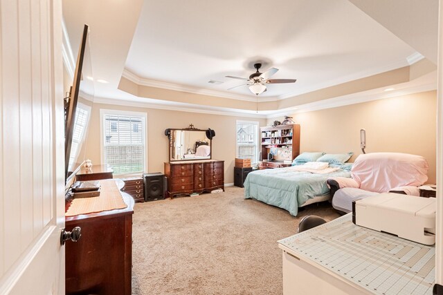 133 Kildeer Dr, Clarksville, TN 37040 - carpeted bedroom featuring a tray ceiling, a ceiling fan, ornamental molding, and visible vents