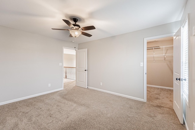 133 Kildeer Dr, Clarksville, TN 37040 - unfurnished bedroom featuring a closet, baseboards, a spacious closet, a ceiling fan, and carpet