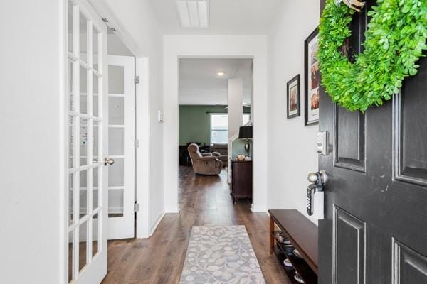 entryway featuring visible vents, dark wood-style floors, and french doors