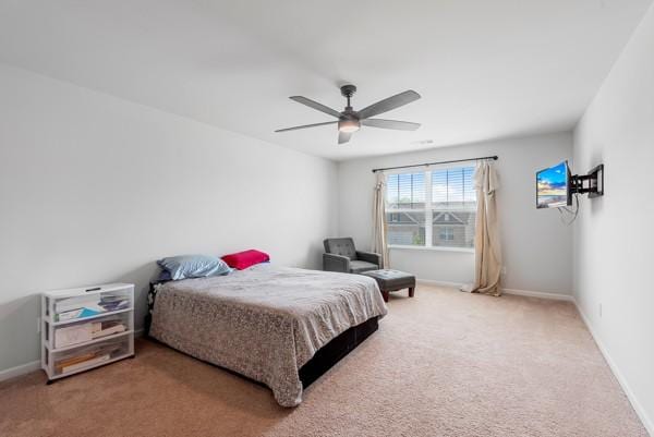 bedroom with carpet floors, baseboards, and ceiling fan