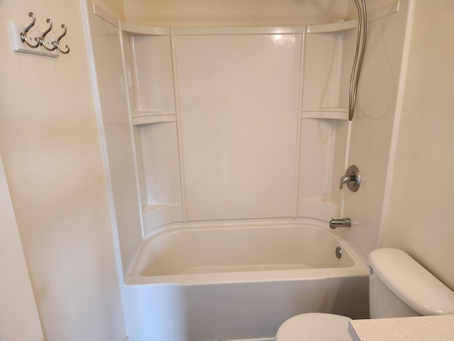bathroom with toilet and bathing tub / shower combination