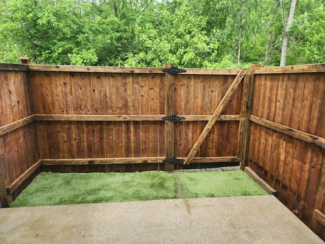 exterior space with a gate and fence