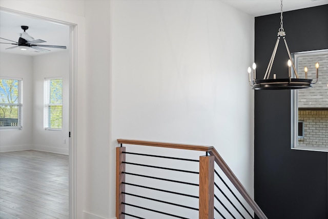 416 Mercomatic Dr, Nashville, TN 37209 - stairway with ceiling fan with notable chandelier, wood finished floors, and baseboards