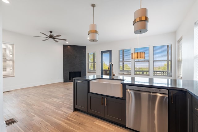 416 Mercomatic Dr, Nashville, TN 37209 - kitchen with pendant lighting, a ceiling fan, a large fireplace, dishwasher, and a sink