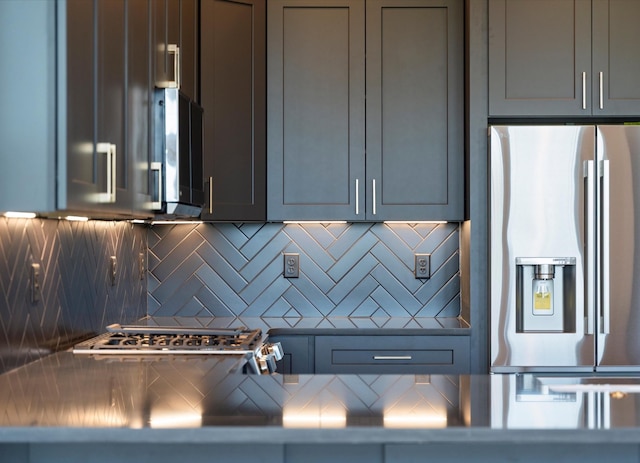 416 Mercomatic Dr, Nashville, TN 37209 - kitchen with gray cabinets, decorative backsplash, and appliances with stainless steel finishes