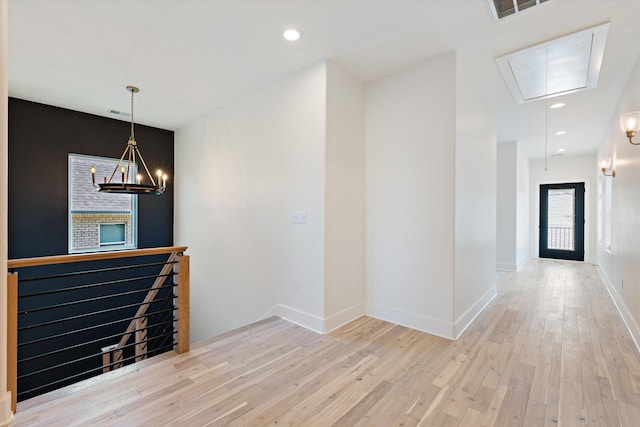 416 Mercomatic Dr, Nashville, TN 37209 - corridor with baseboards, an inviting chandelier, an upstairs landing, attic access, and hardwood / wood-style floors