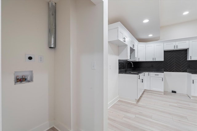 416 Mercomatic Dr, Nashville, TN 37209 - kitchen featuring recessed lighting, tasteful backsplash, light wood-type flooring, and a sink