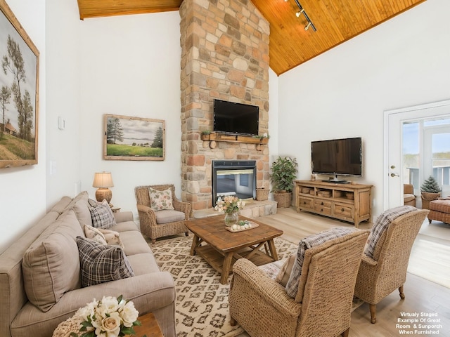 250 Sun Hill Cir, Cadiz, KY 42211 - living area featuring light wood-style floors, high vaulted ceiling, track lighting, a stone fireplace, and wooden ceiling