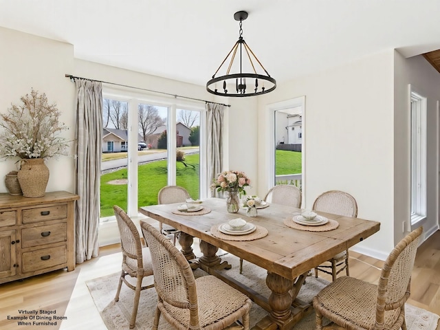 250 Sun Hill Cir, Cadiz, KY 42211 - dining room featuring light wood-style flooring, a notable chandelier, and plenty of natural light