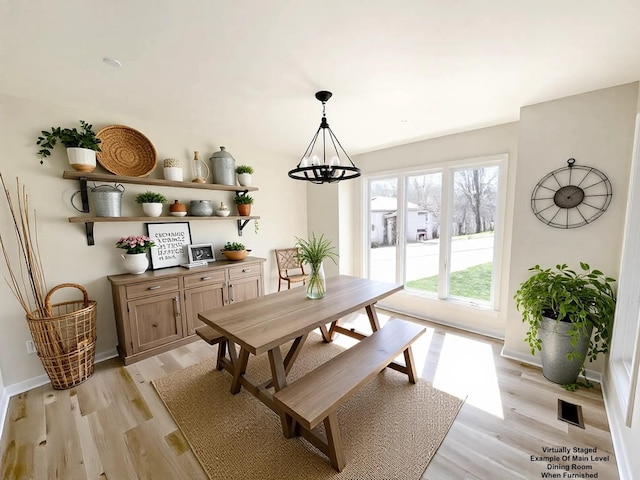 250 Sun Hill Cir, Cadiz, KY 42211 - dining space featuring light wood-style floors, a notable chandelier, baseboards, and visible vents