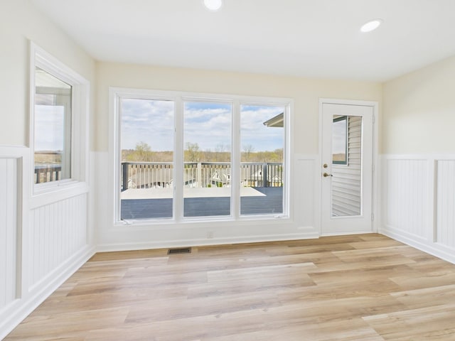250 Sun Hill Cir, Cadiz, KY 42211 - doorway with a decorative wall, visible vents, light wood finished floors, and wainscoting
