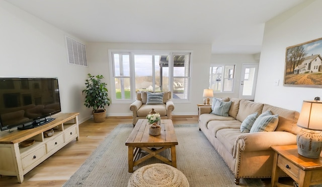 250 Sun Hill Cir, Cadiz, KY 42211 - living room featuring visible vents, baseboards, plenty of natural light, and light wood-style floors