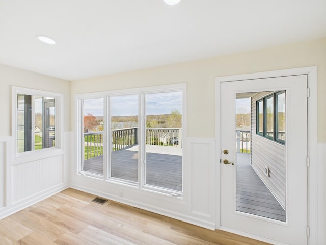 250 Sun Hill Cir, Cadiz, KY 42211 - doorway to outside featuring light wood-type flooring, wainscoting, and plenty of natural light