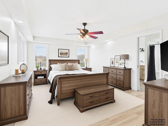 250 Sun Hill Cir, Cadiz, KY 42211 - bedroom featuring ensuite bathroom, a ceiling fan, a raised ceiling, and light wood-style floors
