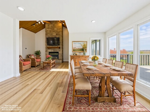 250 Sun Hill Cir, Cadiz, KY 42211 - dining space with light wood-style flooring, baseboards, a fireplace, and lofted ceiling