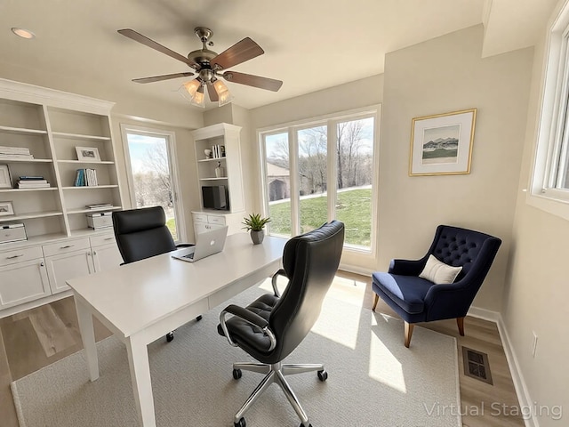 250 Sun Hill Cir, Cadiz, KY 42211 - home office featuring visible vents, a ceiling fan, wood finished floors, and a healthy amount of sunlight