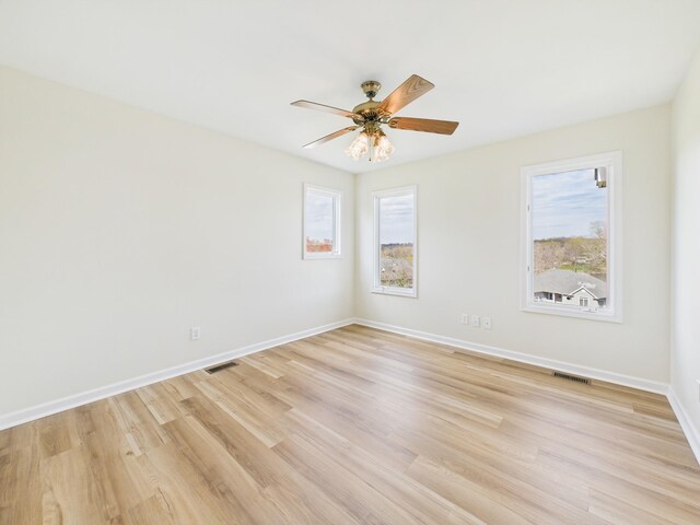 250 Sun Hill Cir, Cadiz, KY 42211 - unfurnished room with light wood finished floors, baseboards, a ceiling fan, and visible vents