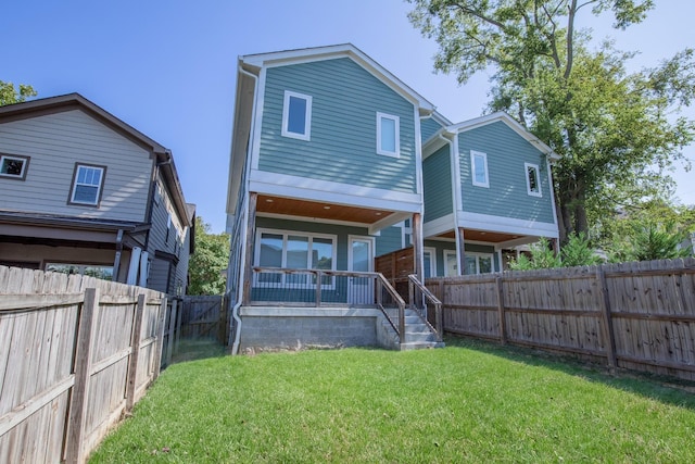 3509B Wrenwood Ave, Nashville, TN 37205 - rear view of property featuring a fenced backyard, a lawn, and covered porch