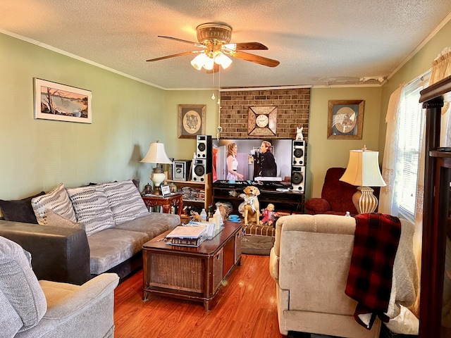 1112 Cumberland St, Decherd, TN 37324 - living room featuring crown molding, wood finished floors, a textured ceiling, and a ceiling fan