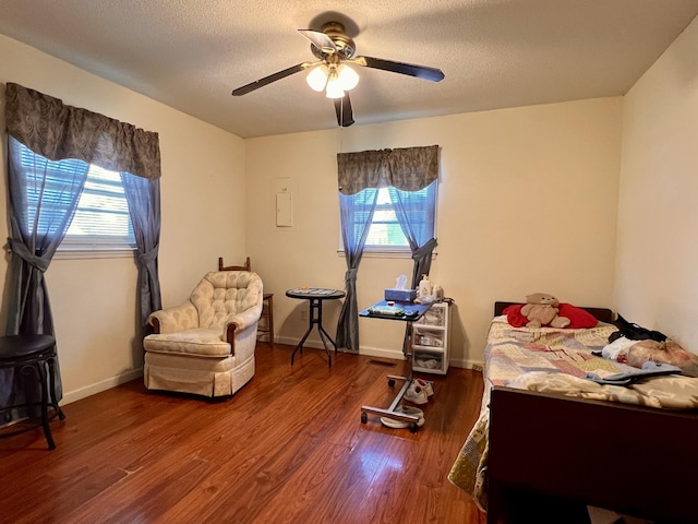 1112 Cumberland St, Decherd, TN 37324 - bedroom featuring ceiling fan, wood finished floors, multiple windows, and a textured ceiling